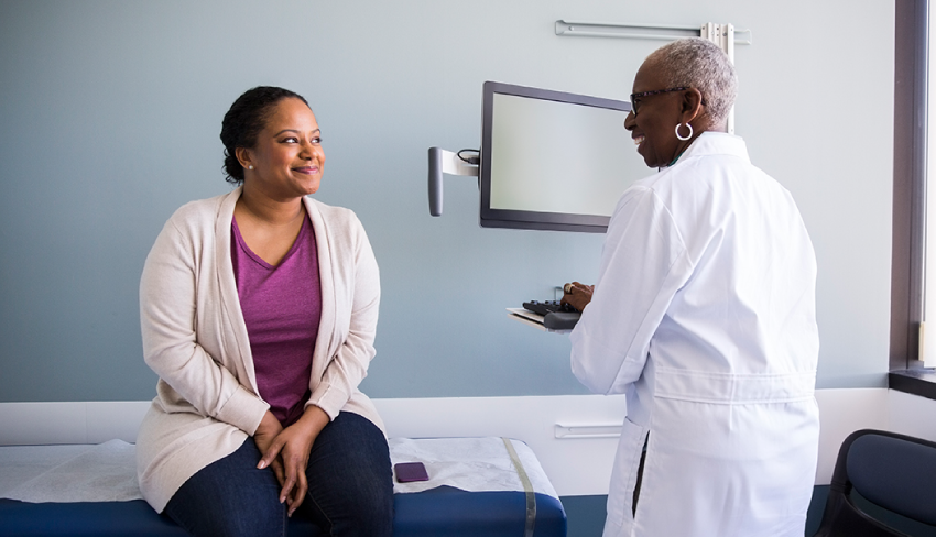 A doctor speaks to her patient about her urinary incontinence. Though it can be scary, it's important to talk with your doctor.